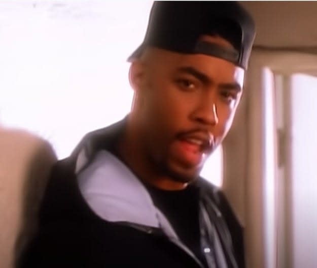 Montell Jordan sings as he poses in the "This Is How We Do It" music video