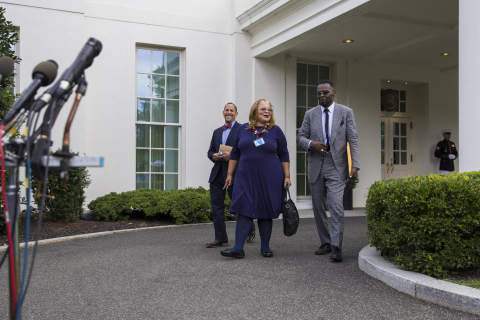 FILE - In this July 29, 2019 file photo, Alveda King, a niece of Martin Luther King, Jr., center, arrives to speak with reporters, accompanied by Rev. Dean Nelson, left, and Bishop Harry Jackson, after meeting with President Donald Trump at the White House in Washington. As the threat of impeachment looms, President Donald Trump is digging in and taking solace in the base that helped him get elected: conservative evangelical Christians who laud his commitment to enacting their agenda. Jackson, a Maryland-based Pentecostal Bishop, has prayed with Trump in the White House, and said that he plans to hold a large prayer gathering this year for “healing in the nation.” (AP Photo/Alex Brandon, File)