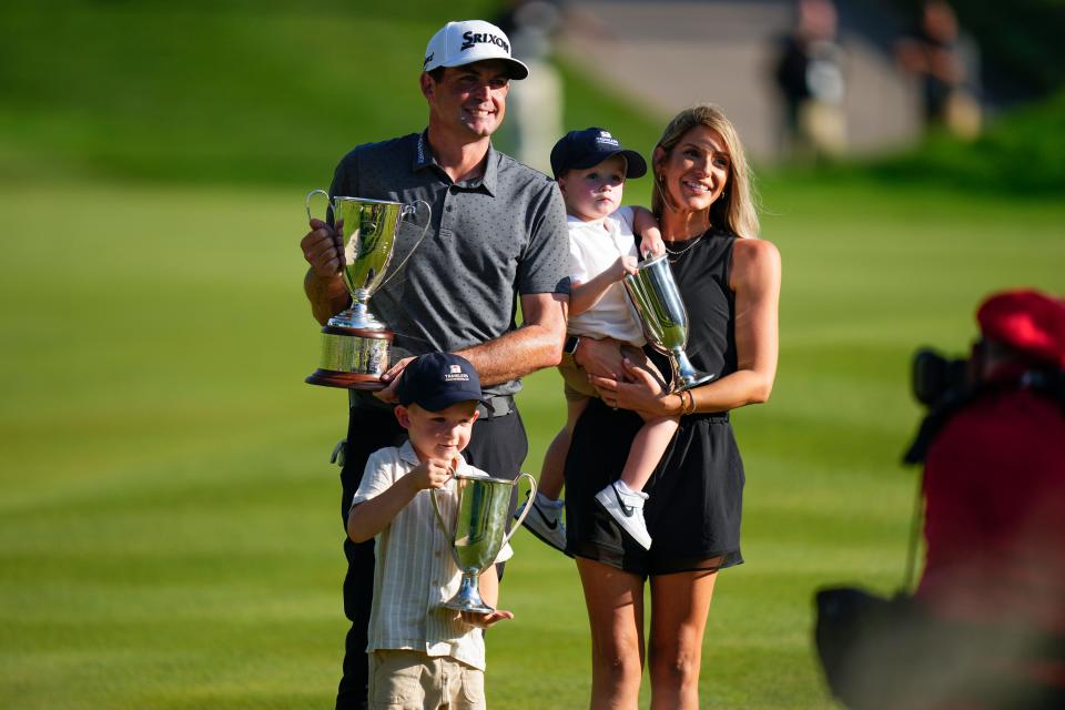 Keegan Bradley celebrates winning the Travelers Championship golf tournament with his family in June.