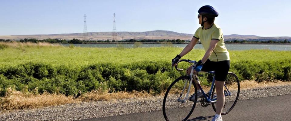 Senior Woman Stopping to Enjoy the Scenery in Eastern Washington State while on a Bike Ride