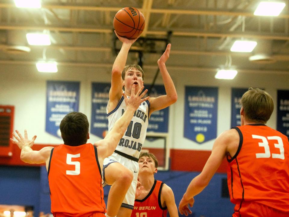 Auburn's Cooper Carter lobs a shot against New Berlin during the Sangamon County Tournament championship game on Friday, Jan. 12, 2024.