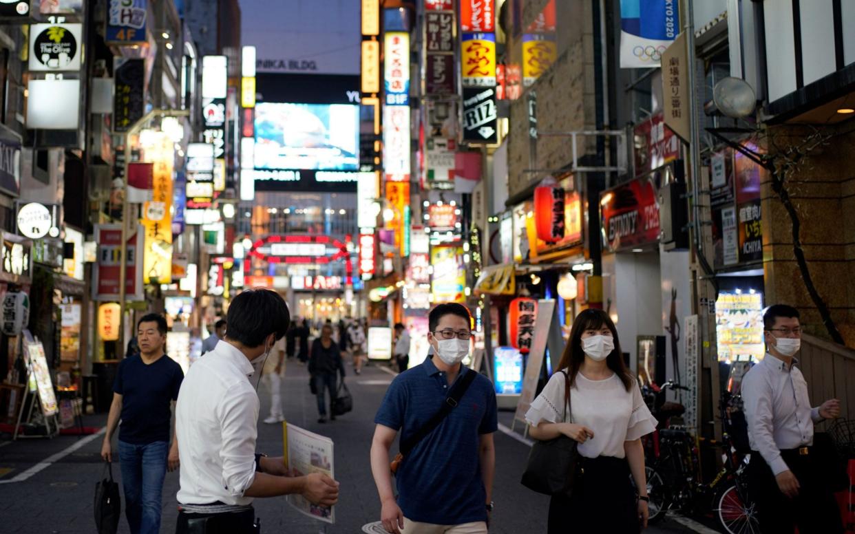 People return to Tokyo's entertainment district - Franck Robichon/Shutterstock