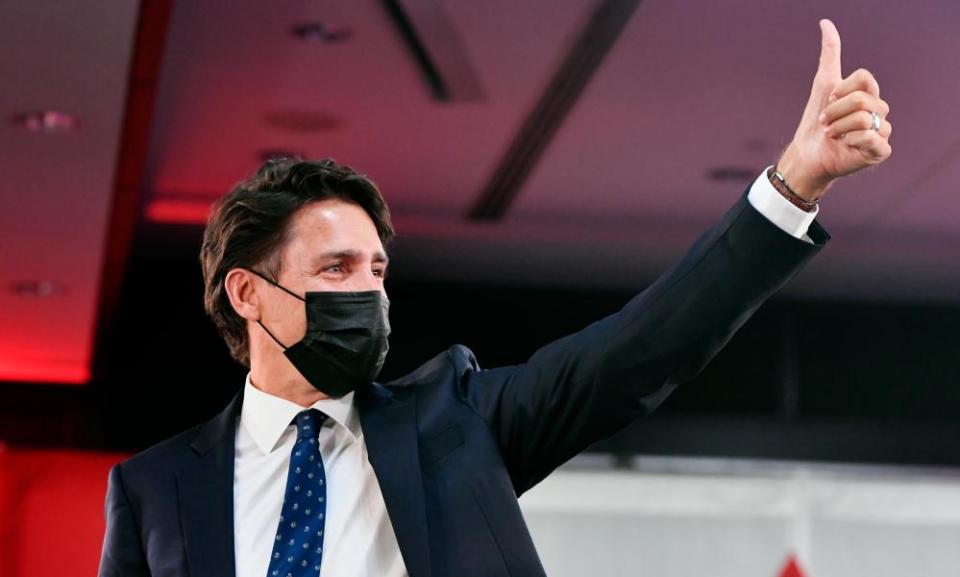 Justin Trudeau greets supporters with a thumbs-up as he celebrates his election victory in Montreal.