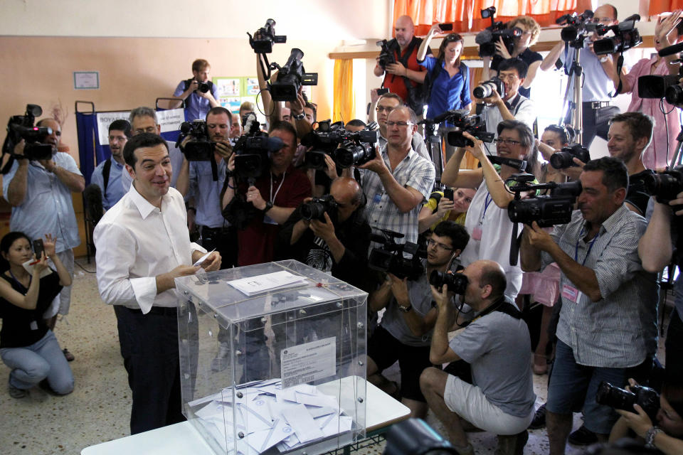 Head of Greece's radical left-wing Syriza party Alexis Tsipras casts his ballot at a voting center in Athens, Sunday, June 17, 2012. Greeks voted Sunday for the second time in six weeks in what was arguably their country's most critical election in 40 years, with the country's treasured place within the European Union's joint currency in the balance. (AP Photo/Petros Karadjias)