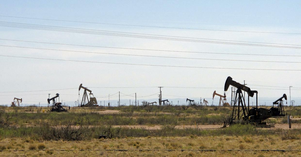 Oil rigs stand in the Loco Hills field on U.S. Highway 82 in Eddy County near Artesia, N.M.