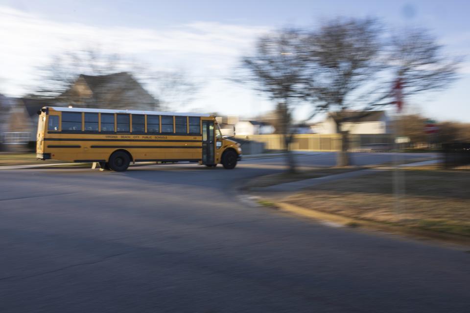 A diesel school bus turns a corner while headed toward school, Tuesday, Feb. 6, 2024, in Virginia Beach, Va. Diesel exhaust from school buses affects one-third of U.S. students, their parents and educators each day. (AP Photo/Tom Brenner)