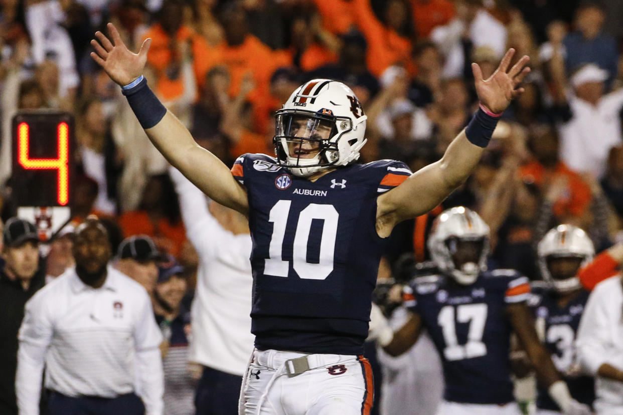 Auburn quarterback Bo Nix reacts after a penalty gave Auburn a first down and secured the win over Alabama during the second half of an NCAA college football game Saturday, Nov. 30, 2019, in Auburn, Ala. Auburn won 48-45. (AP Photo/Butch Dill)