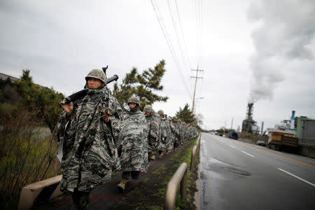 FILE PHOTO: South Korean marines march during a military exercise as a part of the annual joint military training called Foal Eagle between South Korea and the U.S. in Pohang, South Korea, April 5, 2018. REUTERS/Kim Hong-Ji/File Photo