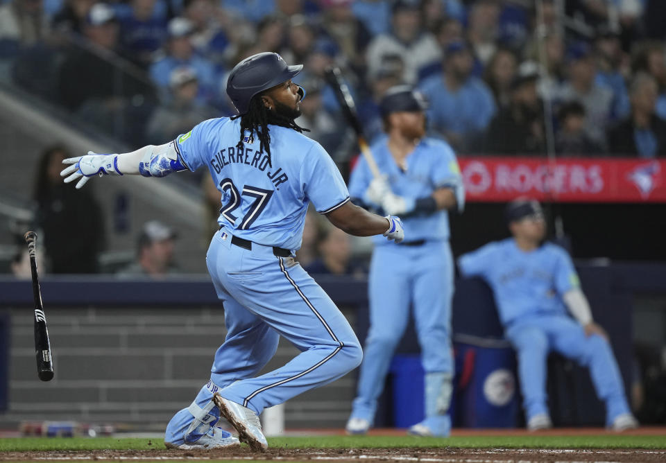 Toronto Blue Jays' Vladimir Guerrero Jr. watches his RBI double against the Kansas City Royals during sixth-inning baseball game action in Toronto, Monday, April 29, 2024. (Nathan Denette/The Canadian Press via AP)