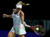 Tennis - Singapore WTA Finals Round Robin Singles - Singapore Indoor Stadium, Singapore - 25/10/2016 - Angelique Kerber of Germany in action against Simona Halep of Romania. REUTERS/Edgar Su