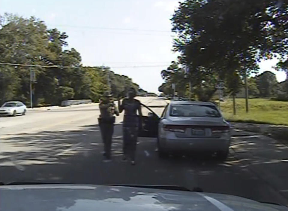 FILE - In this July 10, 2015 image made from dashcam video provided by the Texas Department of Public Safety, trooper Brian Encinia arrests Sandra Bland after she became combative during a routine traffic stop in Waller County, Texas. Bland was taken to the Waller County Jail that day and was found dead in her cell on July 13. (Texas Department of Public Safety via AP)