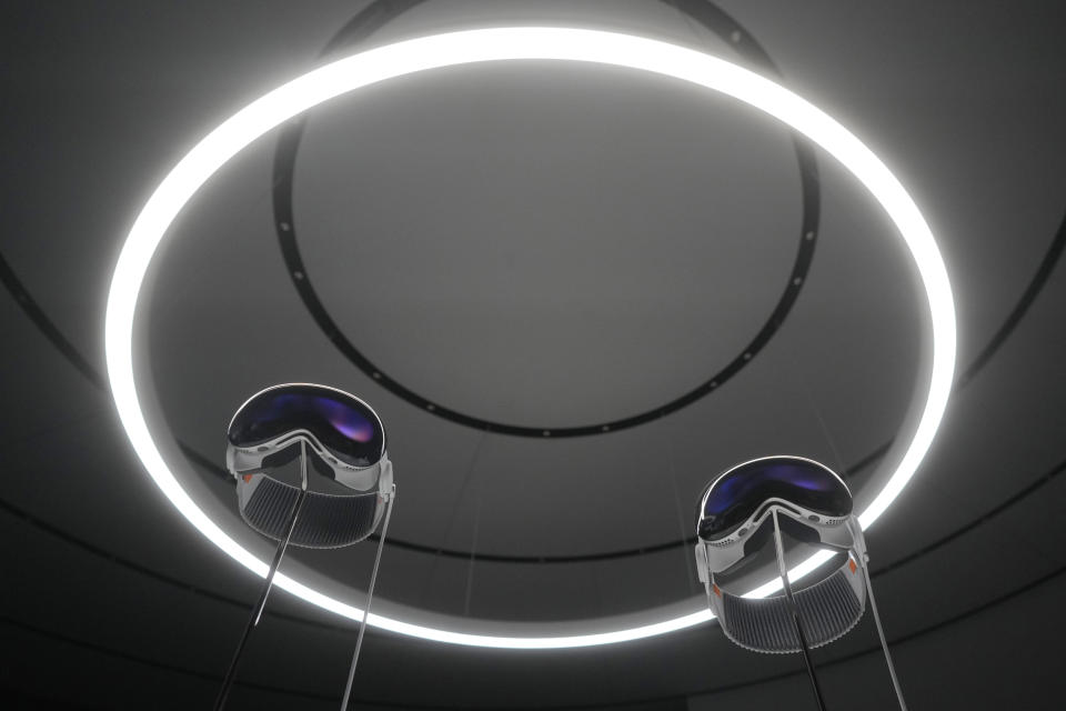 A pair of Apple Vision Pro headsets are displayed in a showroom on the Apple campus Monday, June 5, 2023, in Cupertino, Calif. (AP Photo/Jeff Chiu)