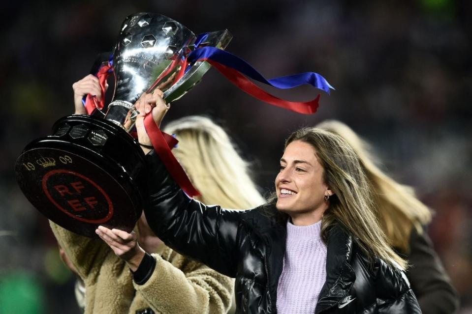 Alexia Putellas presents Barcelona third title in a row to the fans at the Nou Camp (AFP via Getty Images)