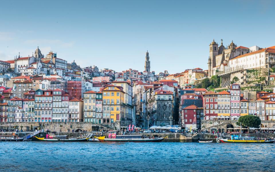 Porto's river banks are crowded with hip new bars and cool pavement restaurants - Tanatat Pongpibool