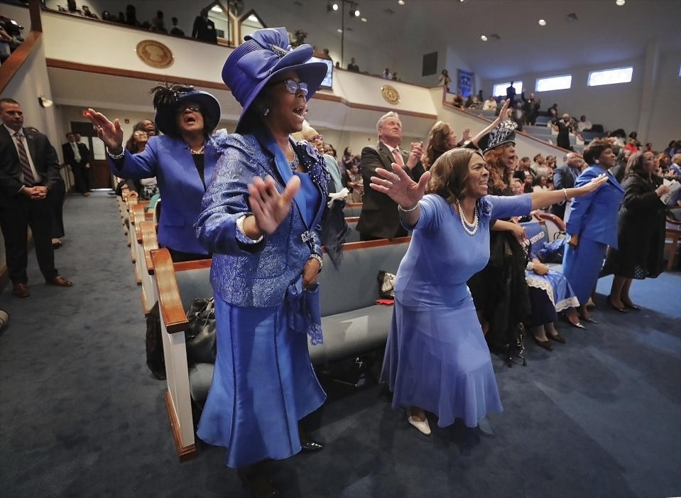 Members of the congregation of the Holy City Church of God In Christ dance in the aisle during a church service that was attended by Vice President Mike Pence Sunday, Jan. 19, 2020. Pence spoke at the church service in remembrance of the Rev. Martin Luther King Jr., the day before the federal holiday named after the civil rights leader. Pence says King touched the hearts of millions of Americans and his words continue to inspire. Pence acknowledged the nation's deep divide and says Americans must rededicate themselves to the ideals that King advanced. (Patrick Lantrip/Daily Memphian via AP)