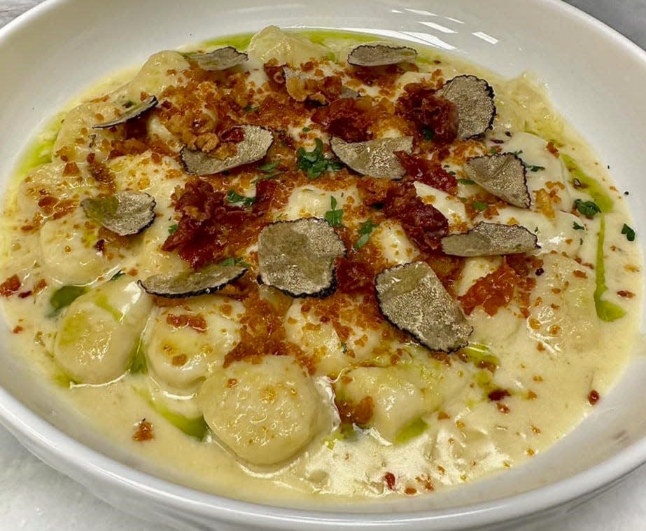 On the menu at Tavolena restaurant in Jupiter: Gnocchi Laviano in Parmesan cream sauce, topped with prosciutto and Umbrian truffles.