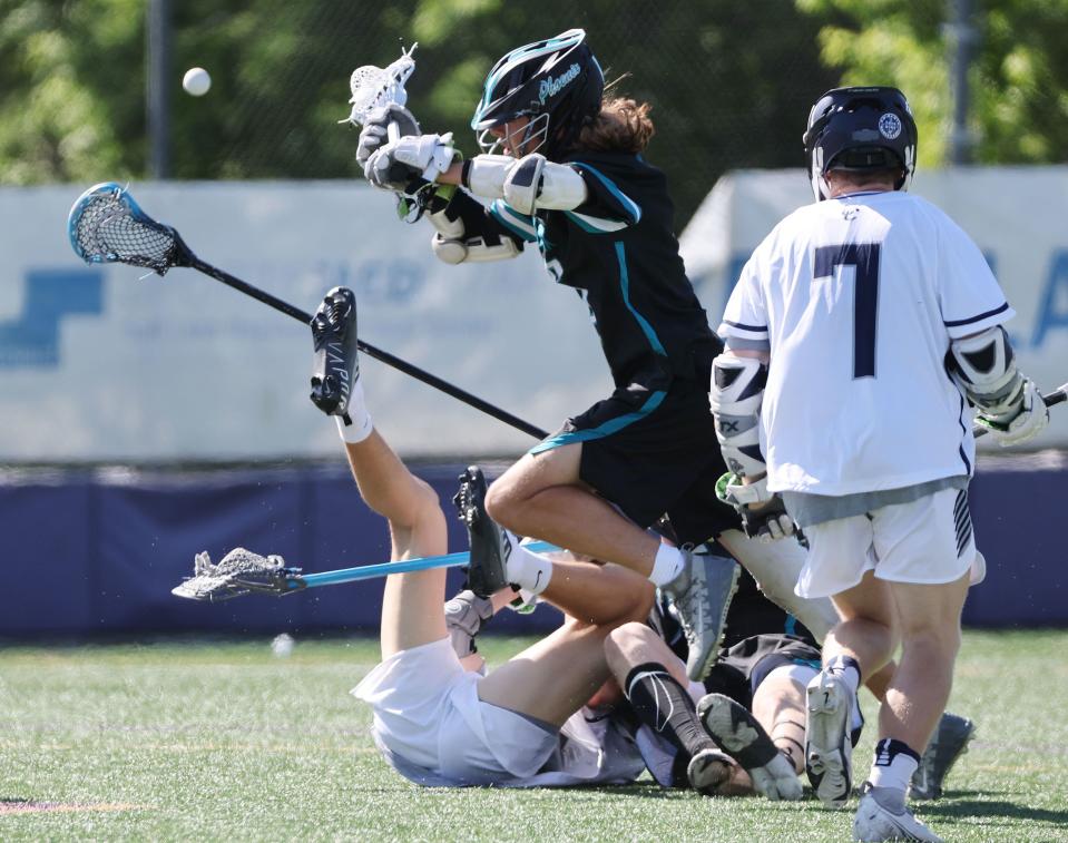 Corner Canyon and Farmington players get tangled up in the 6A boys lacrosse state semifinal in Salt Lake City on Wednesday, May 24, 2023. Corner Canyon won 12-0. | Jeffrey D. Allred, Deseret News
