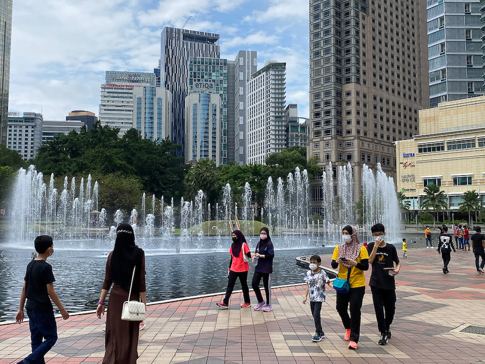 People spend the afternoon at KLCC Park in Kuala Lumpur October 10, 2021. — Picture by Yusof Mat Isa
