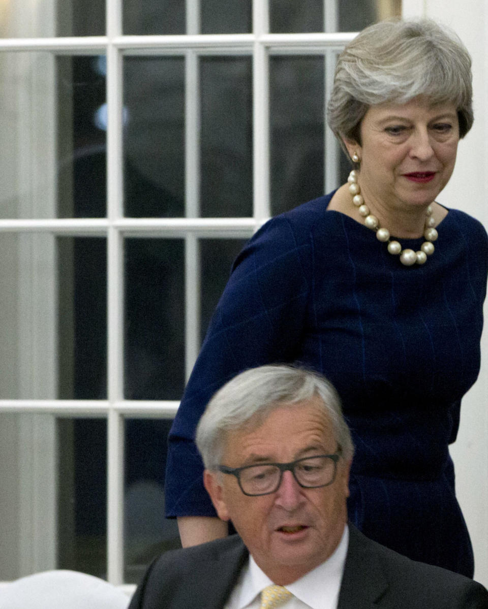 <em>Brexit drama – British Prime Minister Theresa May, right, walks past European Commission President Jean-Claude Juncker (Picture: AP)</em>