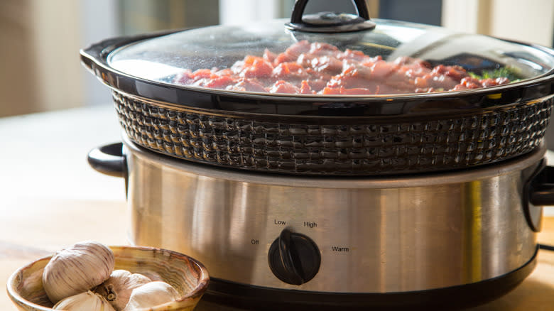 Slow cooker with food inside