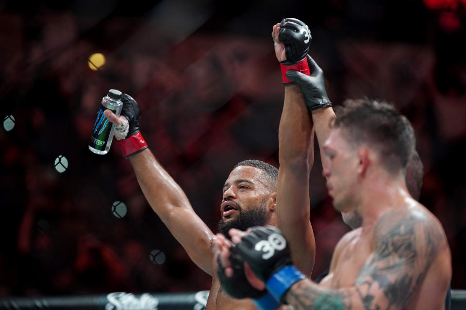 Mar 25, 2023; San Antonio, Texas, USA; Trevin Giles (red gloves) is declared the winner over Preston Parsons (blue gloves) during UFC Fight Night at AT&T Center. Mandatory Credit: Aaron Meullion-USA TODAY Sports