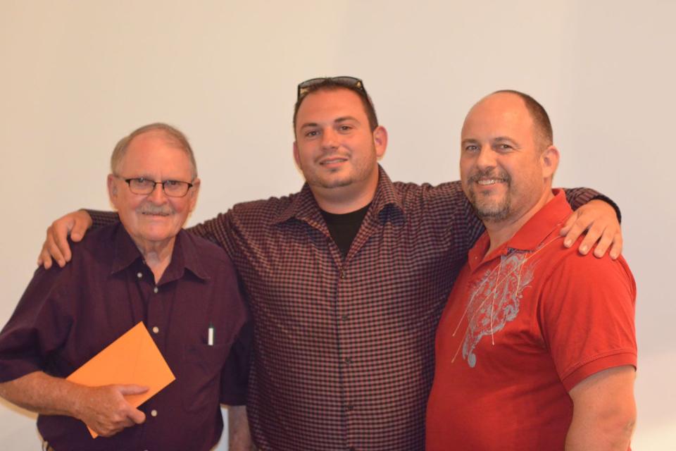 David Harrington (center) with his grandfather, Rodney Harrington, and dad Jon Harrington 