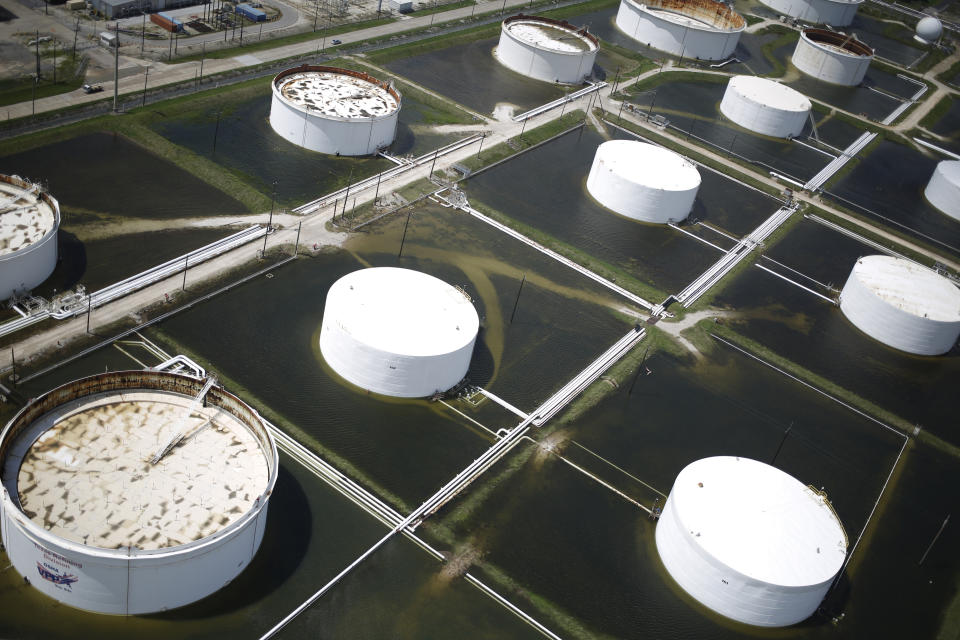 <p>Rainwater from Hurricane Harvey surrounds oil refinery storage tanks in this aerial photograph taken above Texas City, Texas on Wednesday, Aug. 30, 2017. (Photo: Luke Sharrett/Bloomberg via Getty Images) </p>