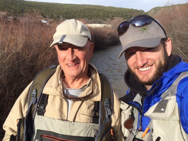 R.G. Carver, with son Josh, loves to go fly fishing in Colorado. He can do so now, as long as he brings his CardioMEMS mat with him and sends his readings back to Marble Falls.