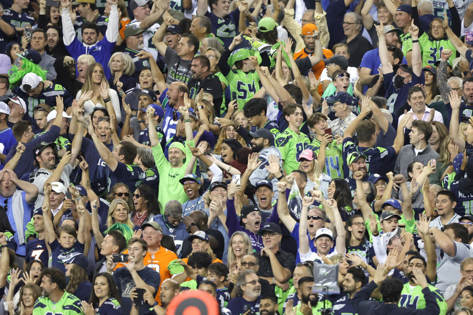 Seattle Seahawks fans celebrate after the Seahawks beat the Denver Broncos 17-16 in an NFL football game, Monday, Sept. 12, 2022, in Seattle. (AP Photo/John Froschauer)