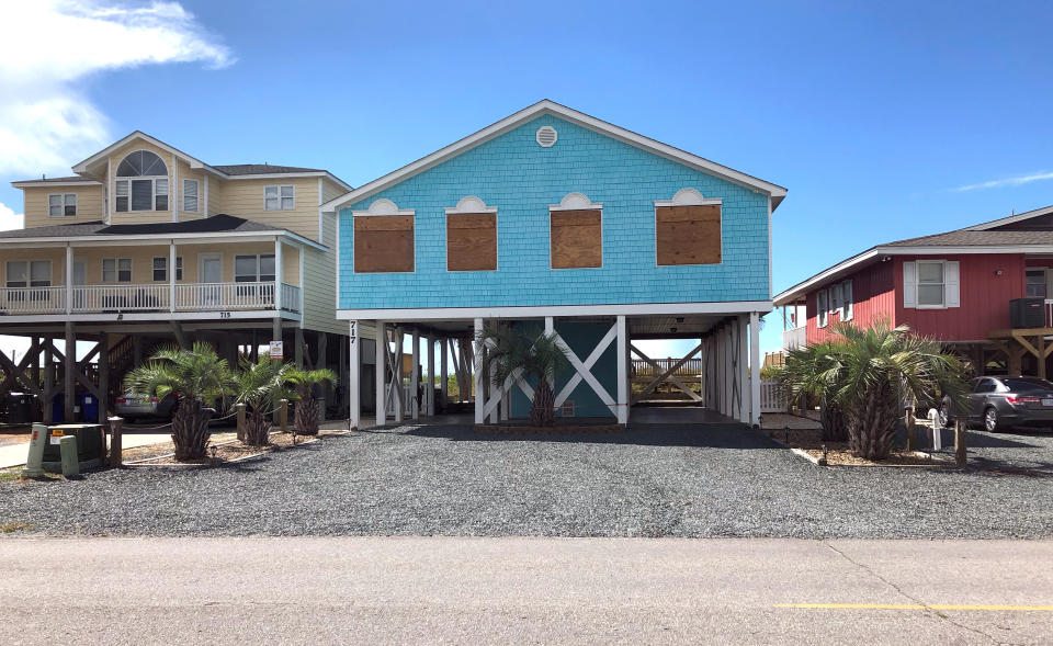 Boarded-up houses are seen ahead of Hurricane Florence's expected landfall at Holden Beach, North Carolina, on Monday.