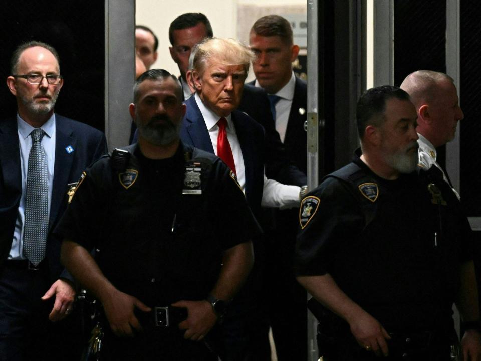 Former US President Donald Trump makes his way inside the Manhattan Criminal Courthouse in New York on April 4, 2023.