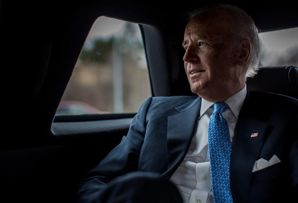 Contemplatively looks out the car window during a planning meeting with staff, Vice President Joe Biden is driven back to the White House after speaking to lawmakers, woman against violence advocates, and constituents concerning reducing domestic violence homicides in Rockville, Md., on March 13, 2013. | The Washington Post—The Washington Post/Getty Images