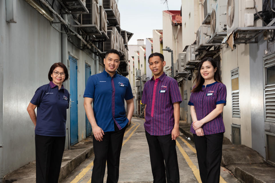 New uniform for SingPost's post office service ambassadors: (from left) philately ambassador, financial ambassador, male and female service ambassadors. (PHOTO: SingPost)