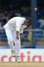 Bowler Darren Sammy of the West Indies delivers during the first day of the second-of-three Test matches between Australia and West Indies April 15, 2012 at Queen's Park Oval in Port of Spain, Trinidad. AFP PHOTO/Stan HONDA (Photo credit should read STAN HONDA/AFP/Getty Images)