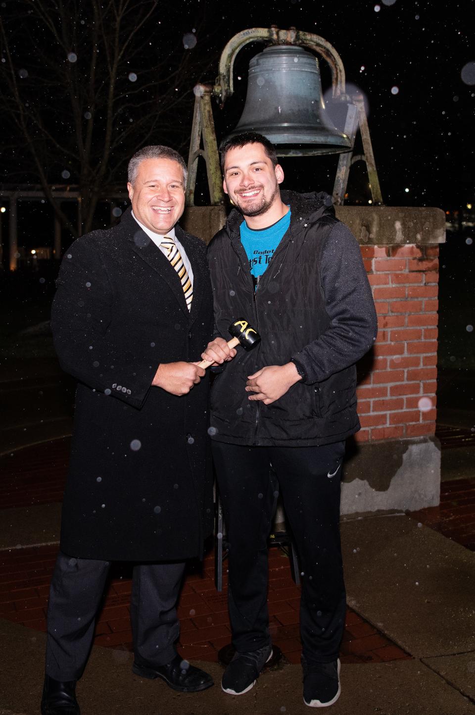Garrett Schermerhorn, right, a secondary social studies student at Adrian College from Morenci, stands alongside longtime Lenawee County educator and Adrian College Teacher Education Assistant Professor Kyle Griffith, during the Nov. 16, 2022, ceremony.