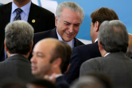 Brazil's President Michel Temer reacts during a ceremony to mark the signing of a decree on new regulations for beef inspection, at the Planalto Palace in Brasilia, Brazil March 29, 2017. Picture taken March 29, 2017. REUTERS/Ueslei Marcelino