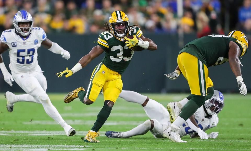 Green Bay Packers running back <a class="link " href="https://sports.yahoo.com/nfl/players/30295" data-i13n="sec:content-canvas;subsec:anchor_text;elm:context_link" data-ylk="slk:Aaron Jones;sec:content-canvas;subsec:anchor_text;elm:context_link;itc:0">Aaron Jones</a> (33) runs the ball against the <a class="link " href="https://sports.yahoo.com/nfl/teams/detroit/" data-i13n="sec:content-canvas;subsec:anchor_text;elm:context_link" data-ylk="slk:Detroit Lions;sec:content-canvas;subsec:anchor_text;elm:context_link;itc:0">Detroit Lions</a> during their football game on Thursday, September 28, 2023, at Lambeau Field in Green Bay, Wis. The Lions won the game, 34-20.<br>Tork Mason/USA TODAY NETWORK-Wisconsin