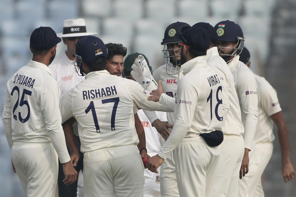 India's Kuldeep Yadav, center, celebrates wicket of Bangladesh's Taijul Islam during the first Test cricket match day third between Bangladesh and India in Chattogram Bangladesh, Friday, Dec. 16, 2022. (AP Photo/Surjeet Yadav)