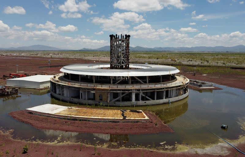 A general view shows parts of the structure of a control tower at an abandoned construction site of a Mexico City airport that was scrapped two years ago, now flooded by summer rains, in Texcoco on the outskirts of Mexico City