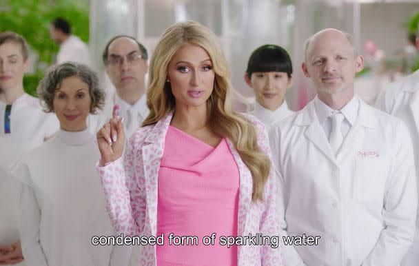 The 36-year-old socialite appears in a new video, promoting a mini drop of water called the NanoDrop - her solution to less plastic pollution! Source: Paris Hilton/Facebook