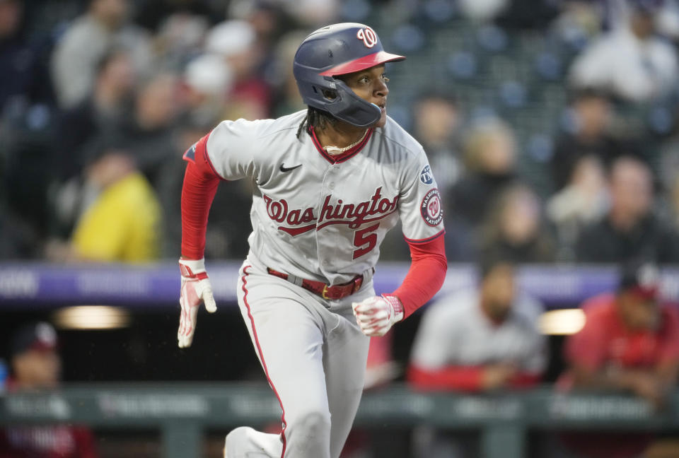 Washington Nationals' CJ Abrams heads up the first base line after connecting for a triple to drive in two runs off Colorado Rockies starting pitcher Jose Urena in the third inning of a baseball game Friday, April 7, 2023, in Denver. (AP Photo/David Zalubowski)