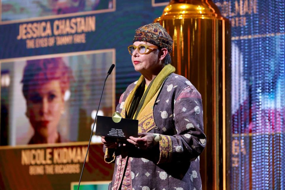 President Sandra Schulberg presenting the Best Actress in a Motion Picture Drama Award onstage during the 79th Annual Golden Globe Awards (HFPA/AFP via Getty Images)