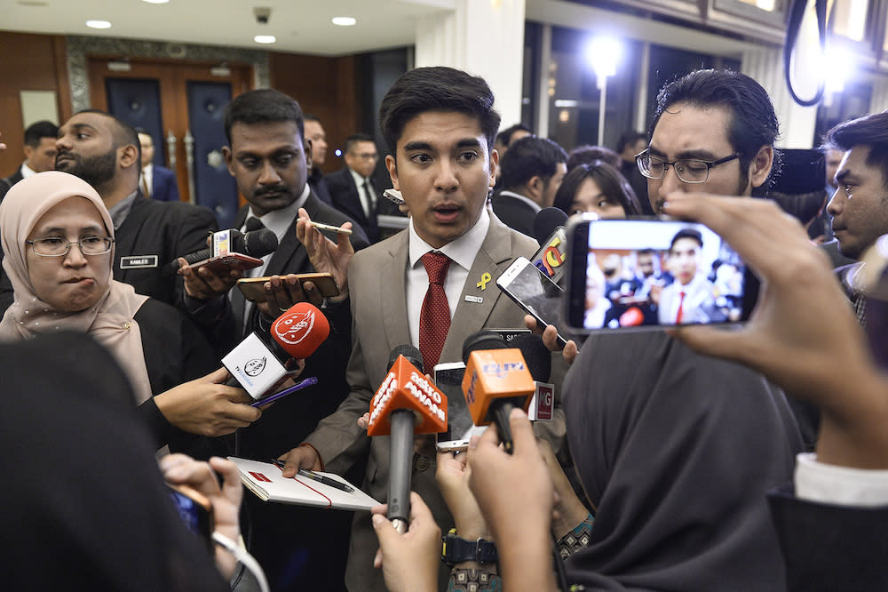 Syed Saddiq Abdul Rahman speaks to reporters in Parliament after the tabling of Budget 2020 on October 11, 2019. — Picture by Miera Zulyana