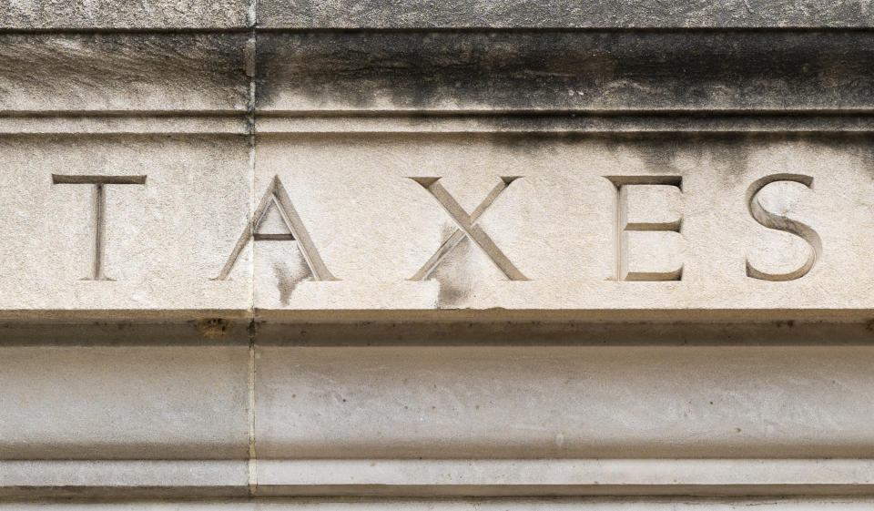 UNITED STATES - JULY 7: The word TAXES  is seen on the facade of the Internal Revenue Service building in Washington on Tuesday, July 7, 2020. (Photo By Bill Clark/CQ-Roll Call, Inc via Getty Images)