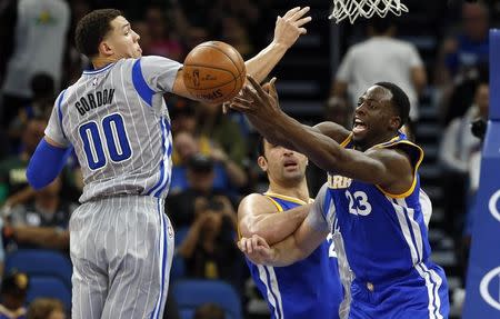 Jan 22, 2017; Orlando, FL, USA;Golden State Warriors forward Draymond Green (23) and Orlando Magic forward Aaron Gordon (00) go after the rebound during the second half at Amway Center. Golden State Warriors defeated the Orlando Magic 118-98. Mandatory Credit: Kim Klement-USA TODAY Sports