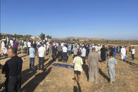 People attend the funeral of Bilal Kissi, who was killed by Algerian forces, in the city of Saaidia, Morocco, Thursday, Aug. 31, 2023. Two men were killed by Algerian forces after they strayed across Morocco’s maritime border with Algeria on water scooters, and a third was detained by Algerian authorities, according to Moroccan media reports.(AP Photo)