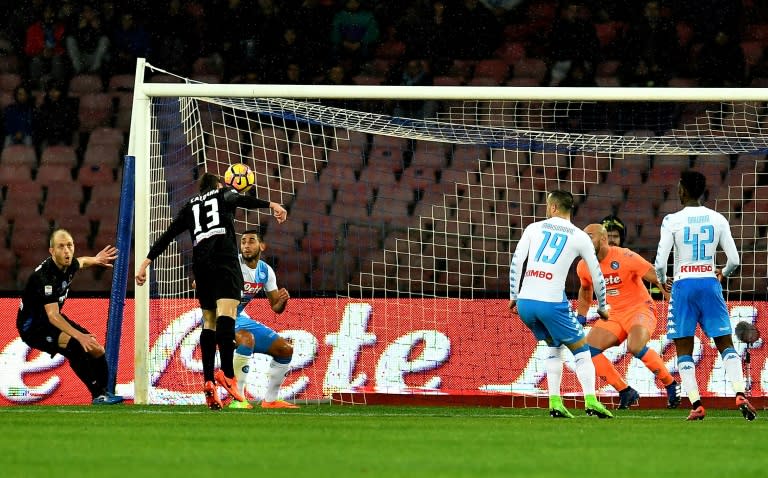 Atalanta's defender Mattia Caldara (L) scores a goal during the Italian Serie A football match against Napoli February 25, 2017