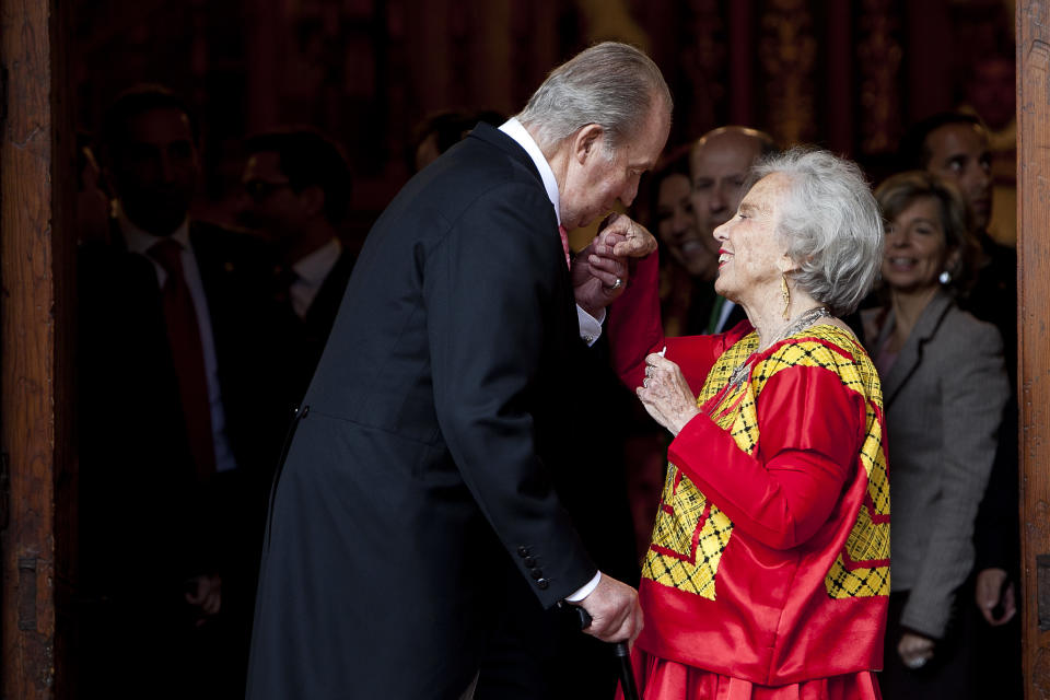 King Juan Carlos of Spain greets to Mexican writer Elena Poniatowska after the Cervantes Prize award ceremony, at the University of Alcala de Henares, Spain, on Wednesday, April 23, 2014. The Cervantes prize is the Spanish-speaking world's top literary honor. (AP Photo/Abraham Caro Marin)