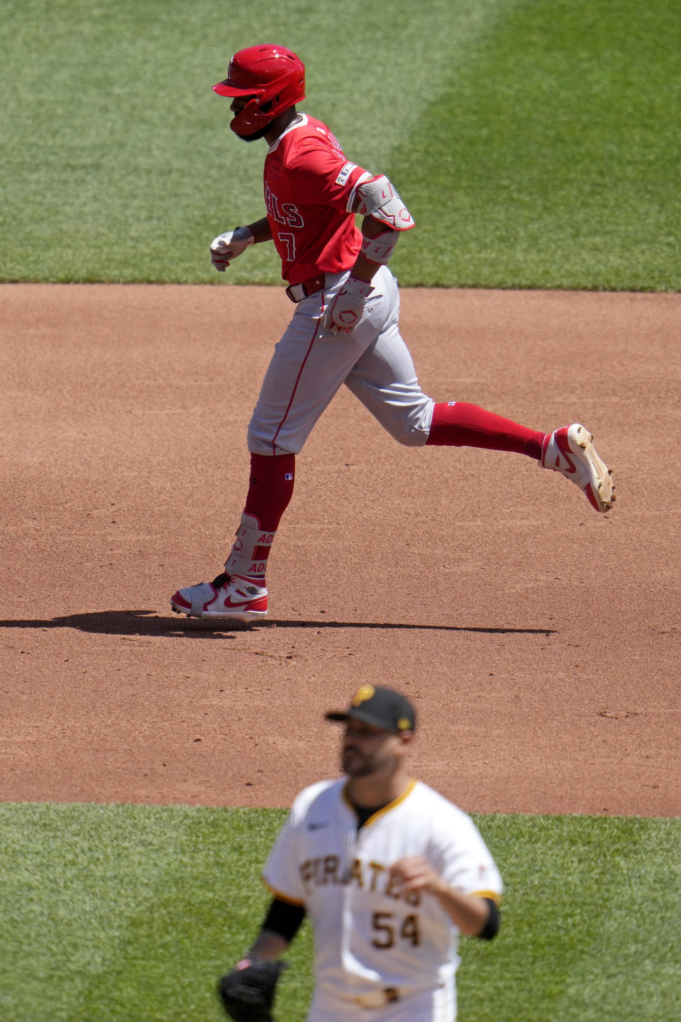 Los Angeles Angels' Jo Adell (7) rounds the bases after hitting a solo home run off Pittsburgh Pirates starting pitcher Martín Pérez (54) during the third inning of a baseball game in Pittsburgh, Wednesday, May 8, 2024. (AP Photo/Gene J. Puskar)