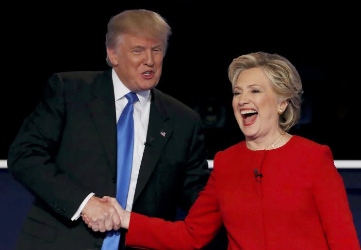 Donald Trump and Hillary Clinton shake hands at the conclusion of their third and final presidential debate.